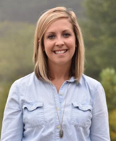 Wall Residences Residential Regional Director Candice Bowman standing outside