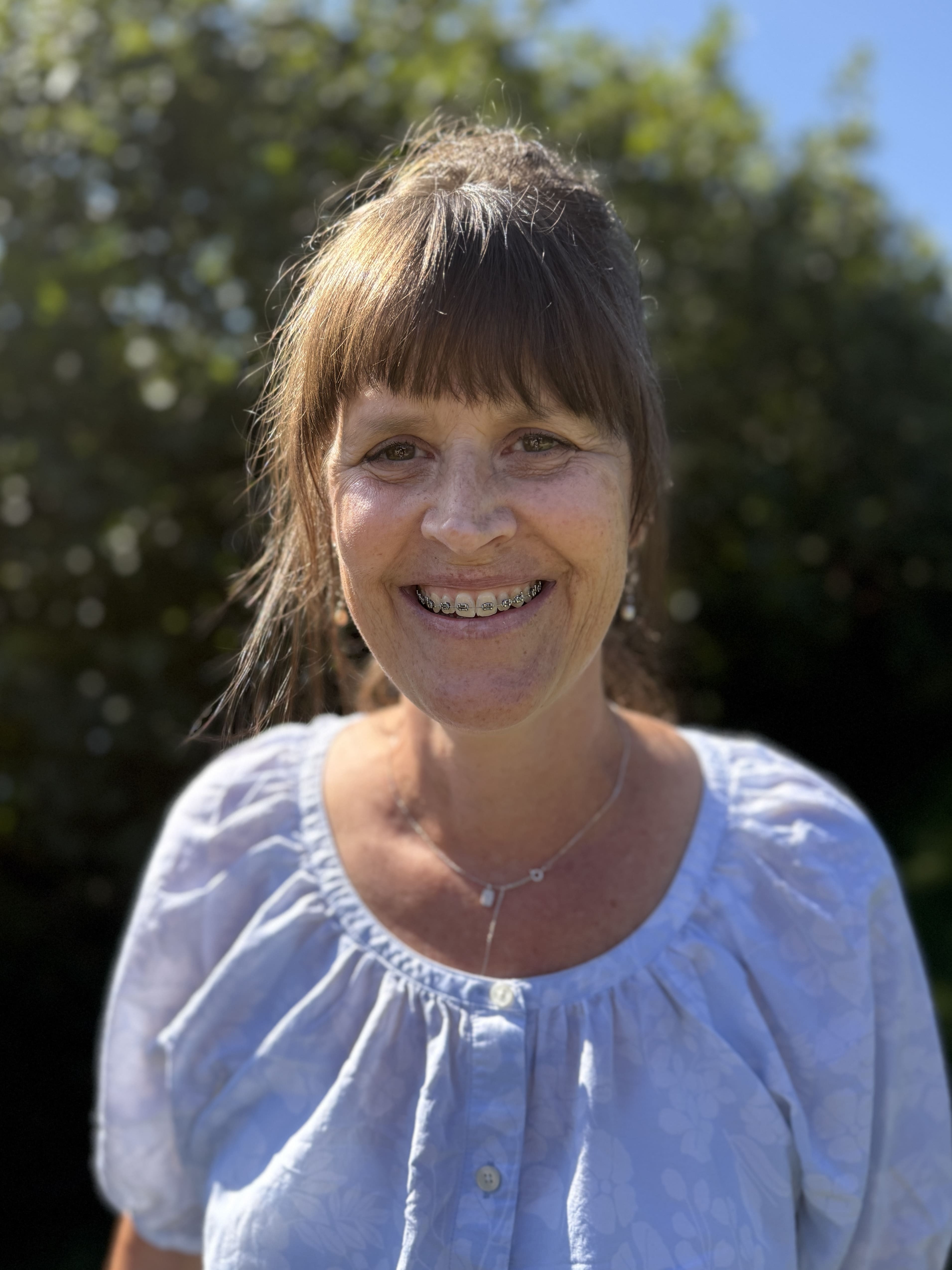 Wall Residences Compliance Director Kathryn Moats standing outside