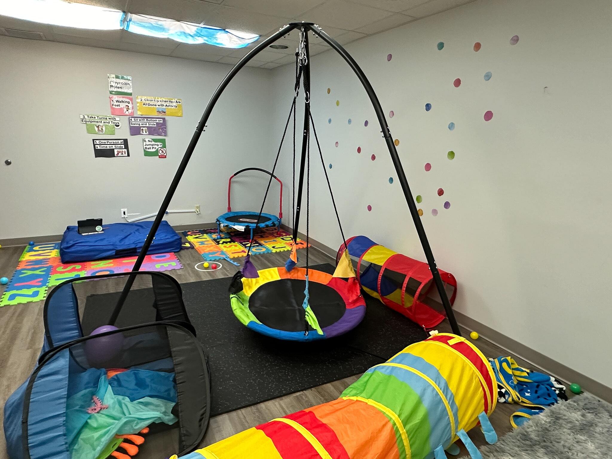 Colorful activities and toys in a sensory room at the Christiansburg ABA Center