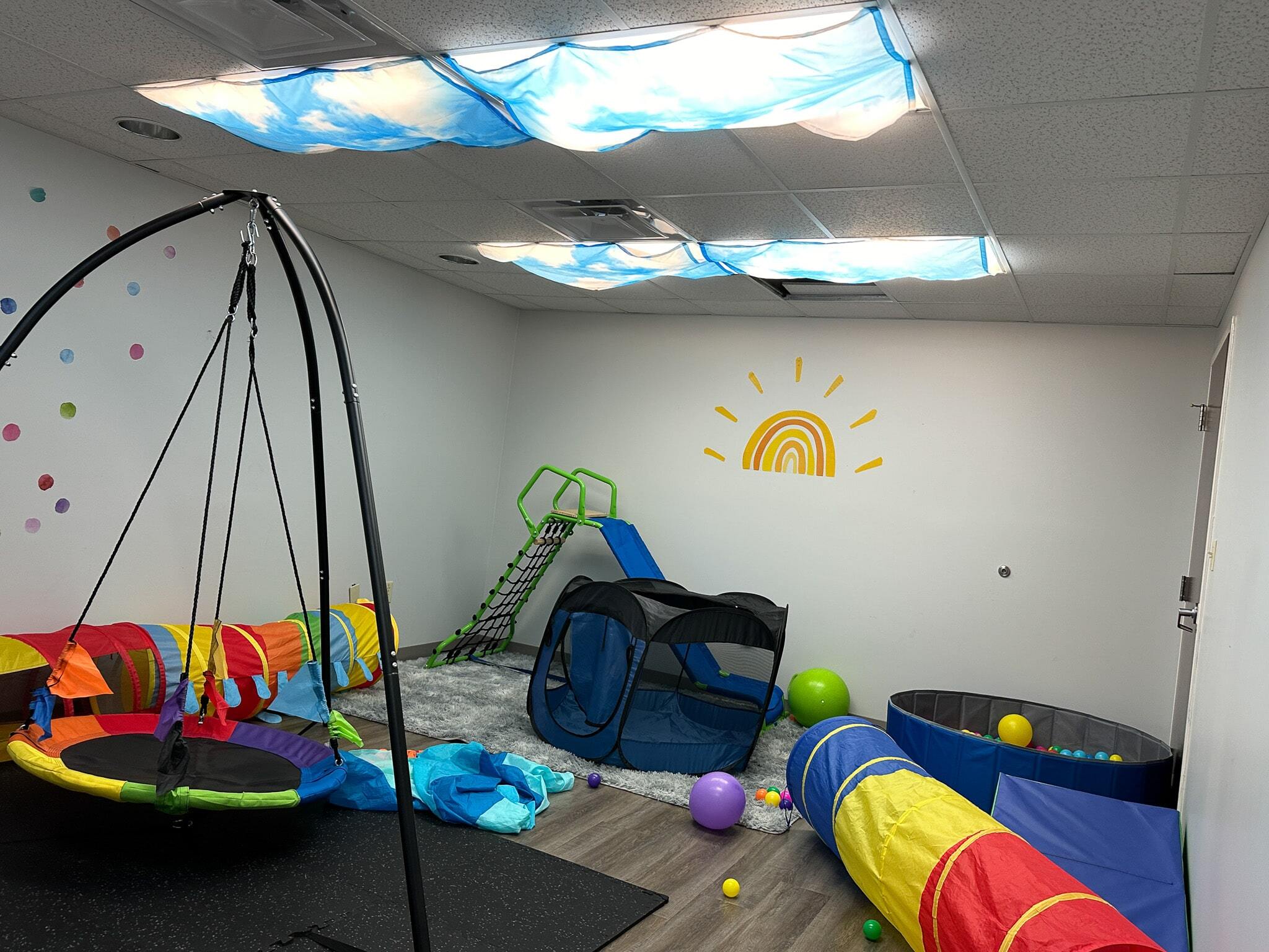 Colorful activities and toys in a sensory room at the Christiansburg ABA Center